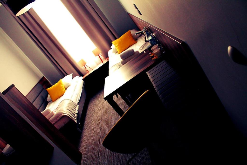 Postel nebo postele na pokoji v ubytování Hotel Klondaik Corner