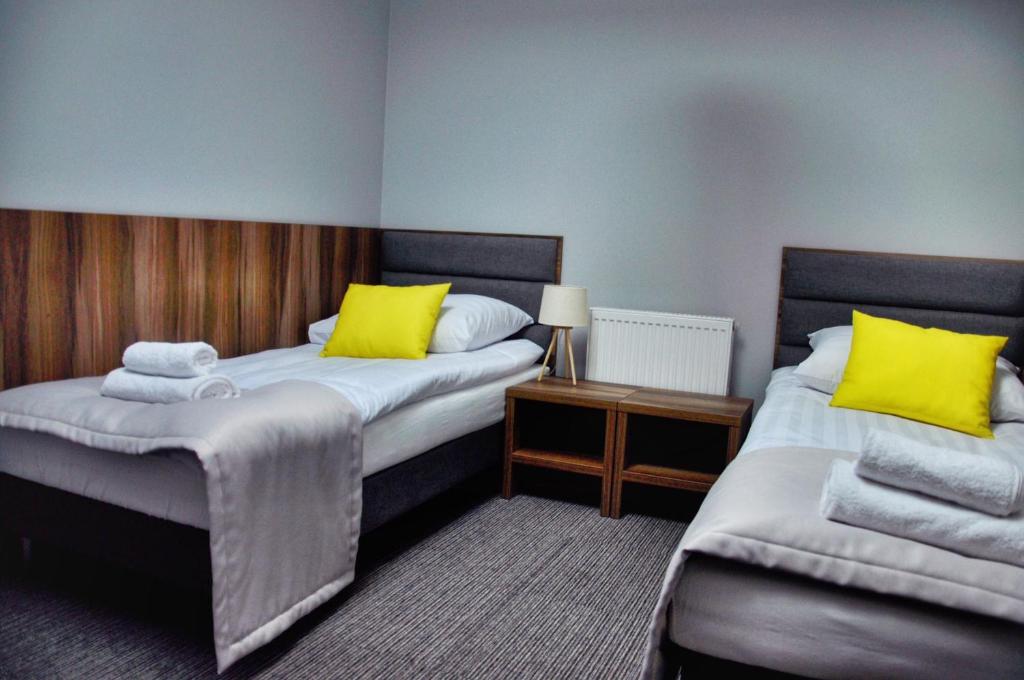 Postel nebo postele na pokoji v ubytování Hotel Klondaik Corner
