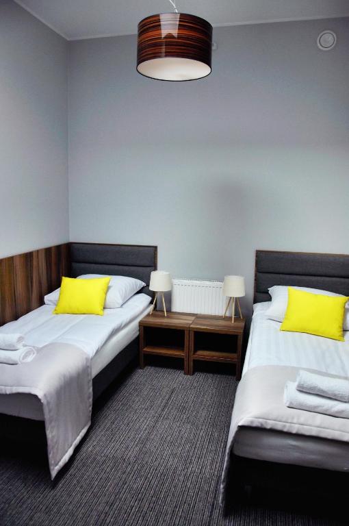 Postel nebo postele na pokoji v ubytování Hotel Klondaik Corner