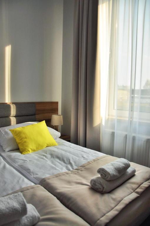 Postel nebo postele na pokoji v ubytování Hotel Klondaik Corner