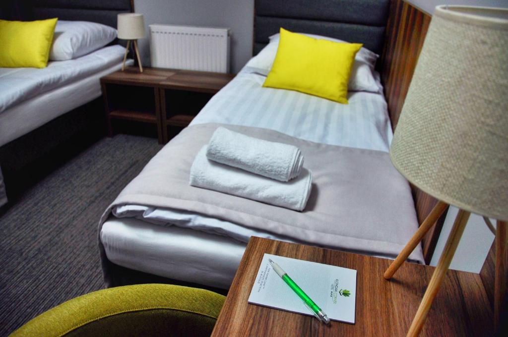 Postel nebo postele na pokoji v ubytování Hotel Klondaik Corner