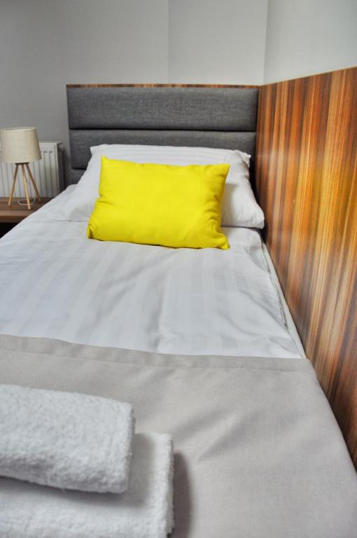 Postel nebo postele na pokoji v ubytování Hotel Klondaik Corner
