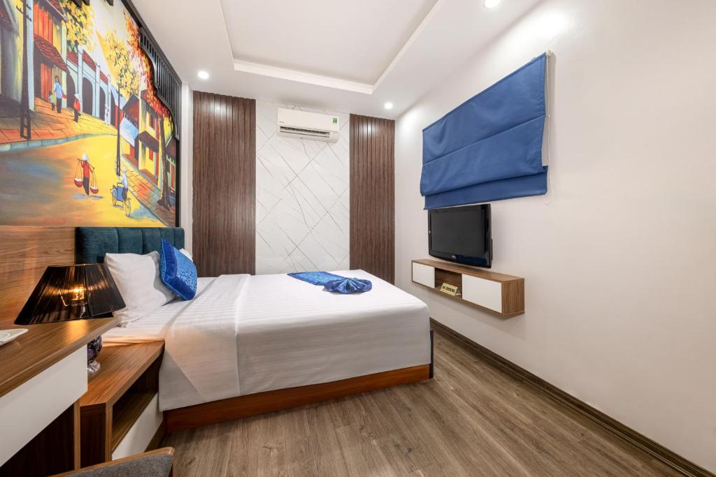 Postel nebo postele na pokoji v ubytování Aquarius Grand Hotel