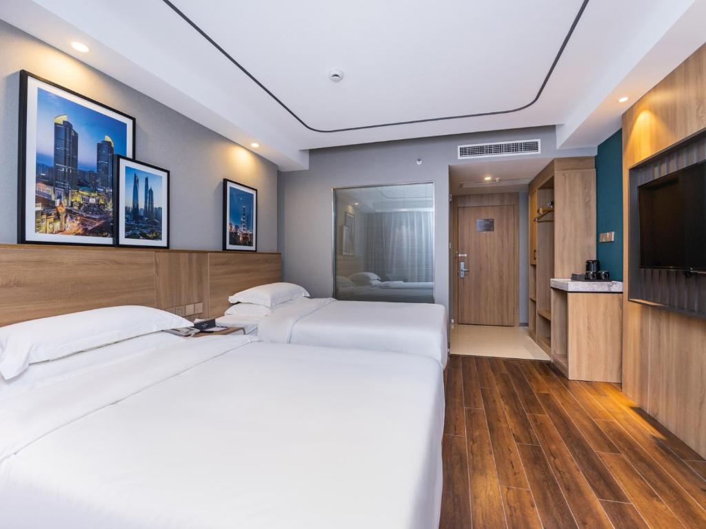 Postel nebo postele na pokoji v ubytování Country Inn&Suites by Radisson, Shanghai PVG