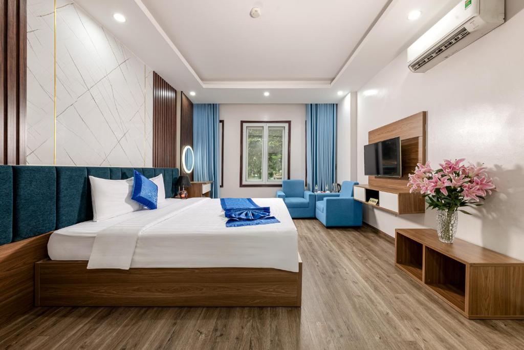 Postel nebo postele na pokoji v ubytování Aquarius Grand Hotel