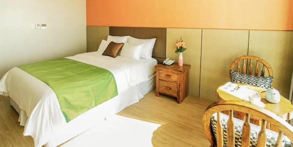 Postel nebo postele na pokoji v ubytování Login Hotel