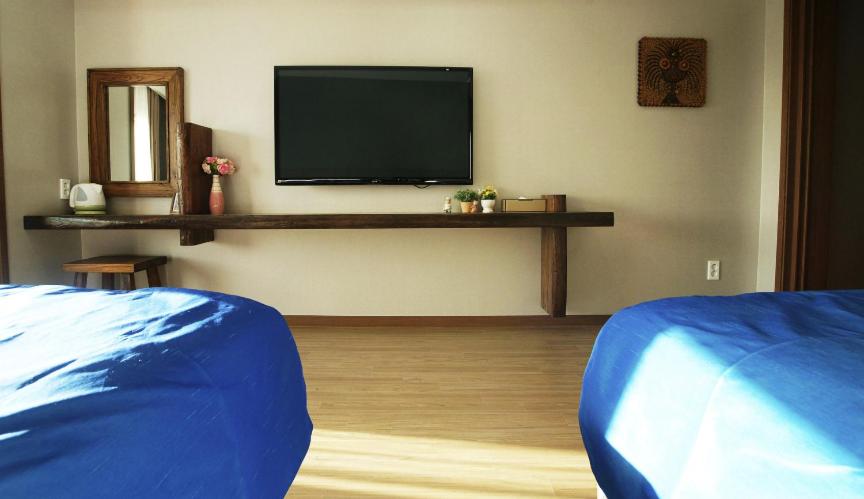 Postel nebo postele na pokoji v ubytování Login Hotel