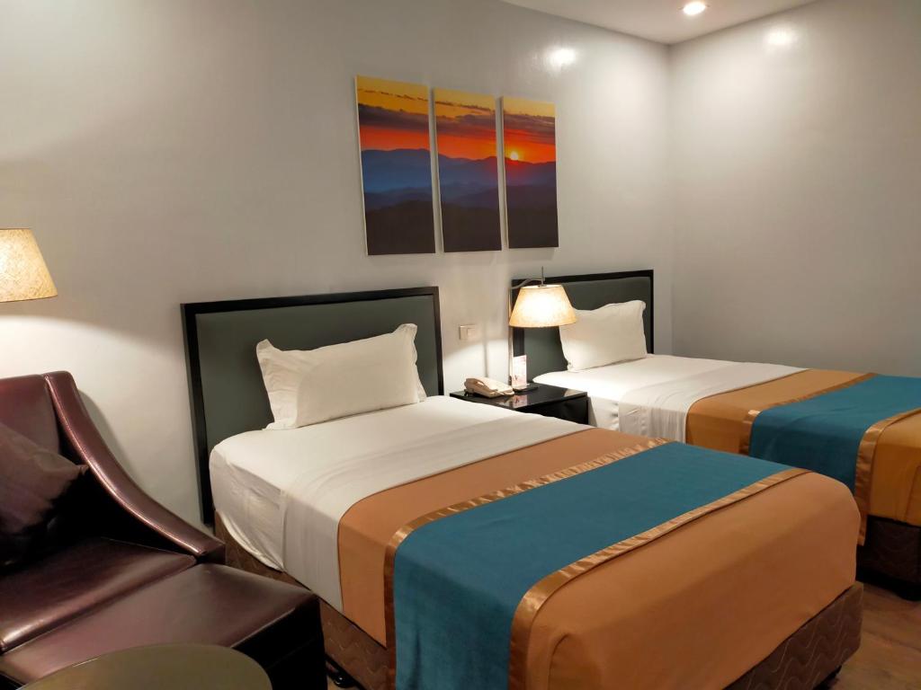 Postel nebo postele na pokoji v ubytování Studio 89 Katipunan QC
