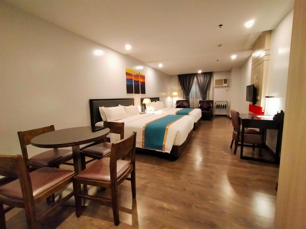 Postel nebo postele na pokoji v ubytování Studio 89 Katipunan QC