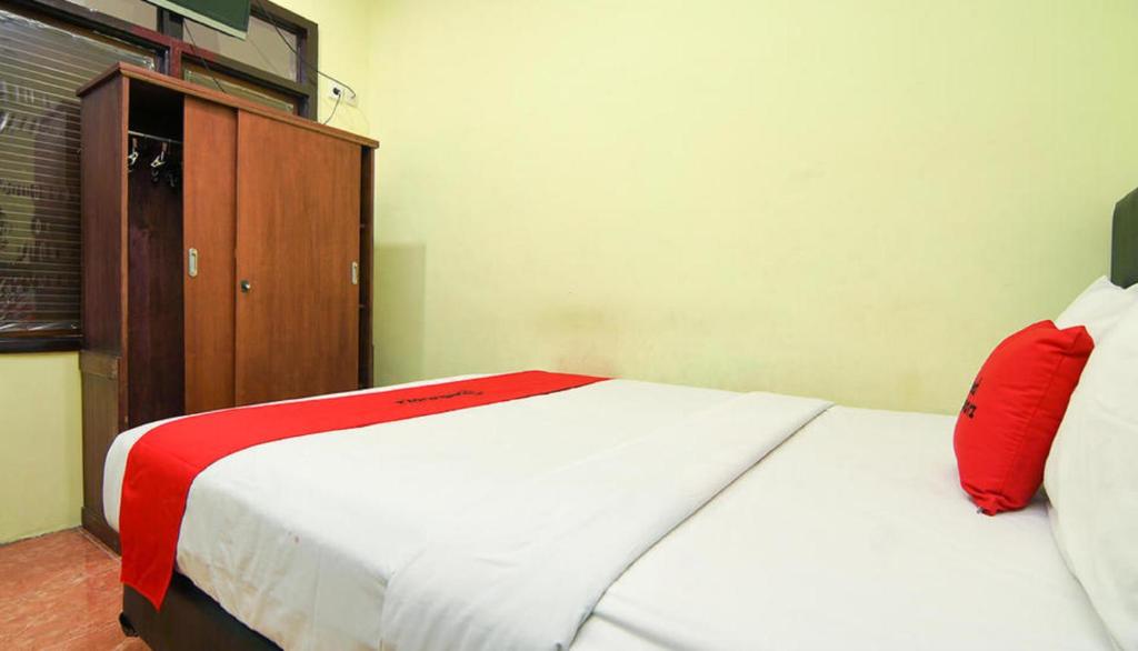 Postel nebo postele na pokoji v ubytování The Legian 777