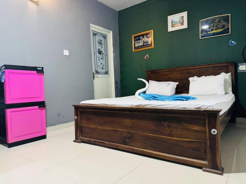 Postel nebo postele na pokoji v ubytování Tiny Homestay
