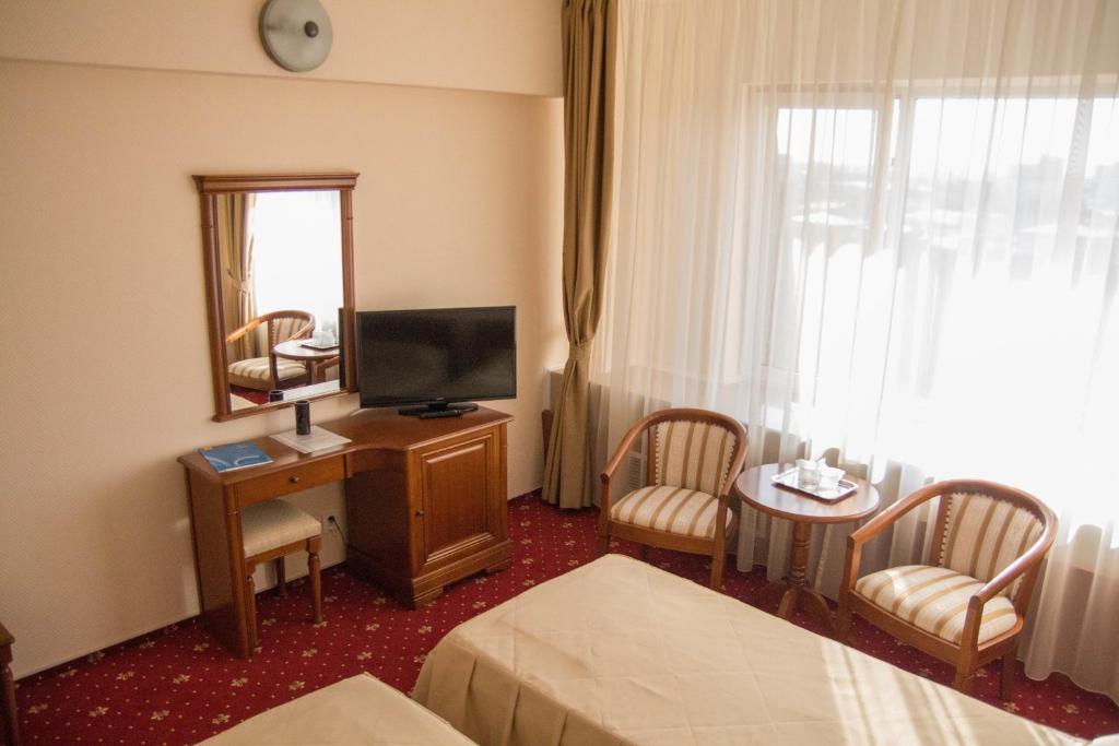 TV a/nebo společenská místnost v ubytování Hotel Traian