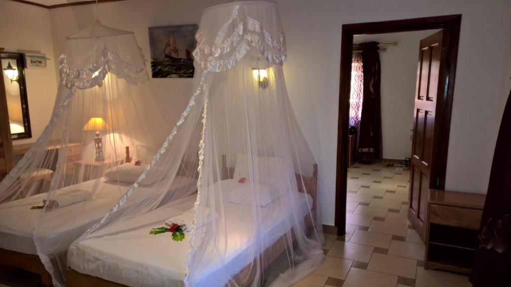 Postel nebo postele na pokoji v ubytování Etoile Labrine Guest House