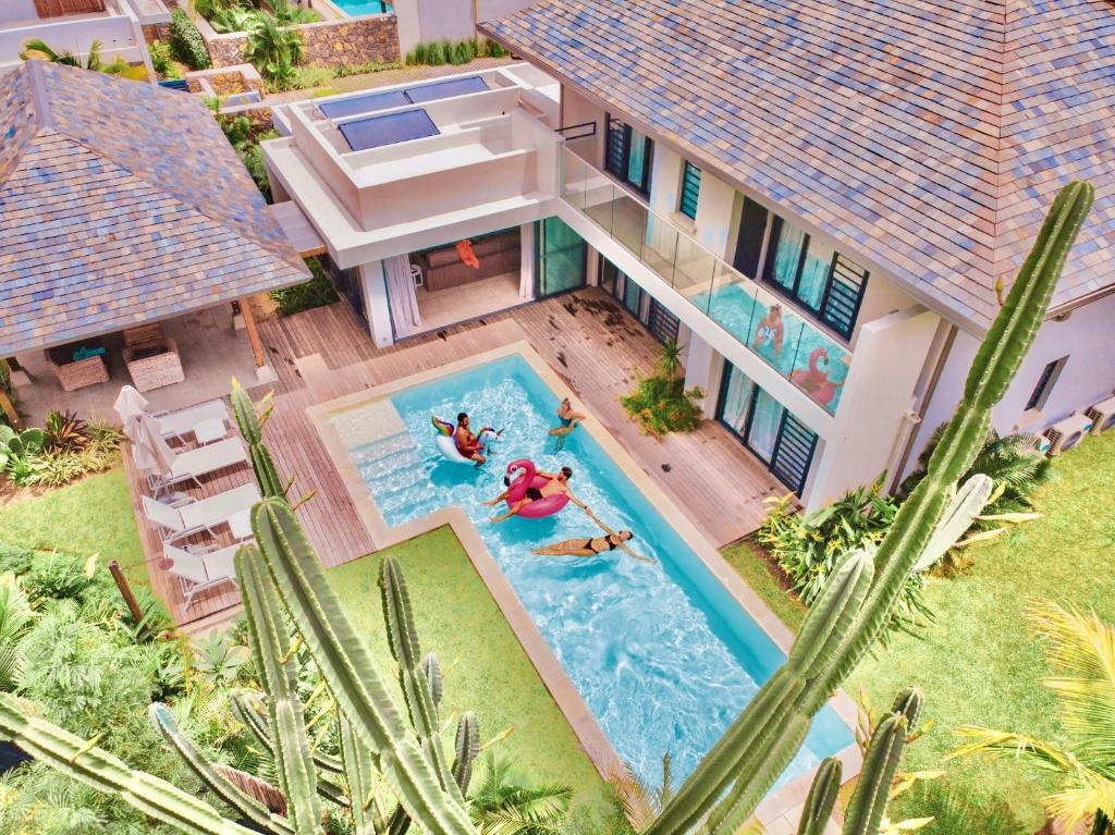 an aerial view of a house with a swimming pool at Marguery Villas in Rivière Noire