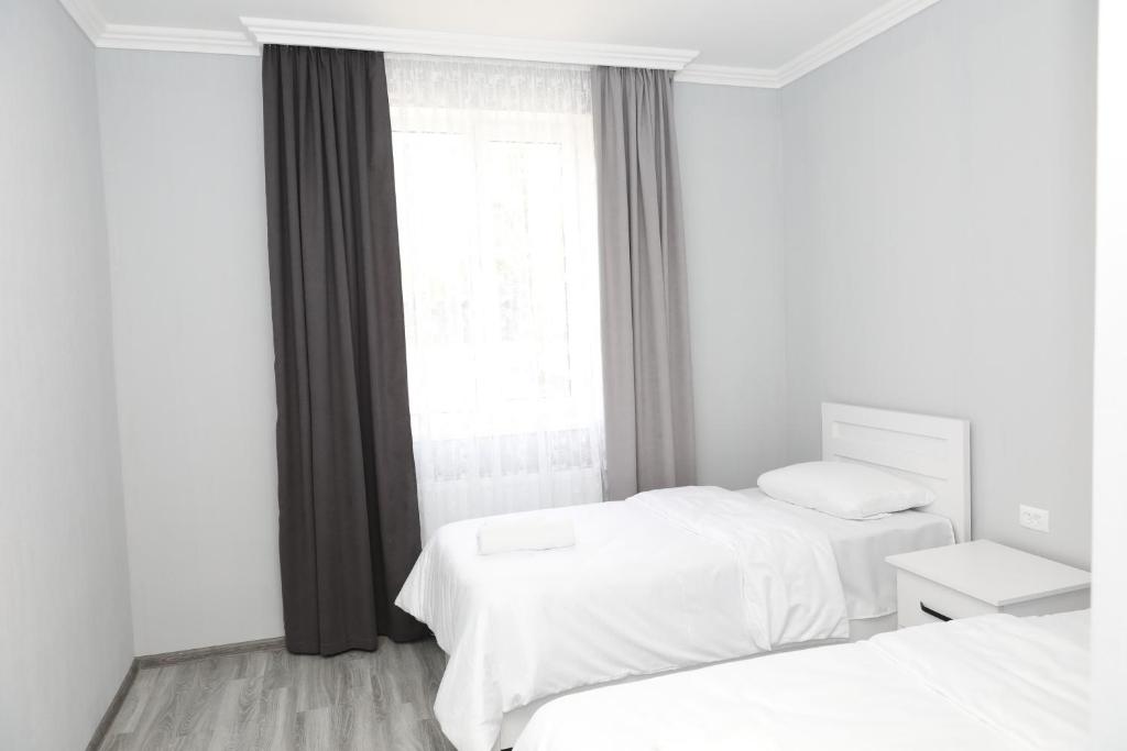 Letto o letti in una camera di VST KHANOYAN'S HOTEL