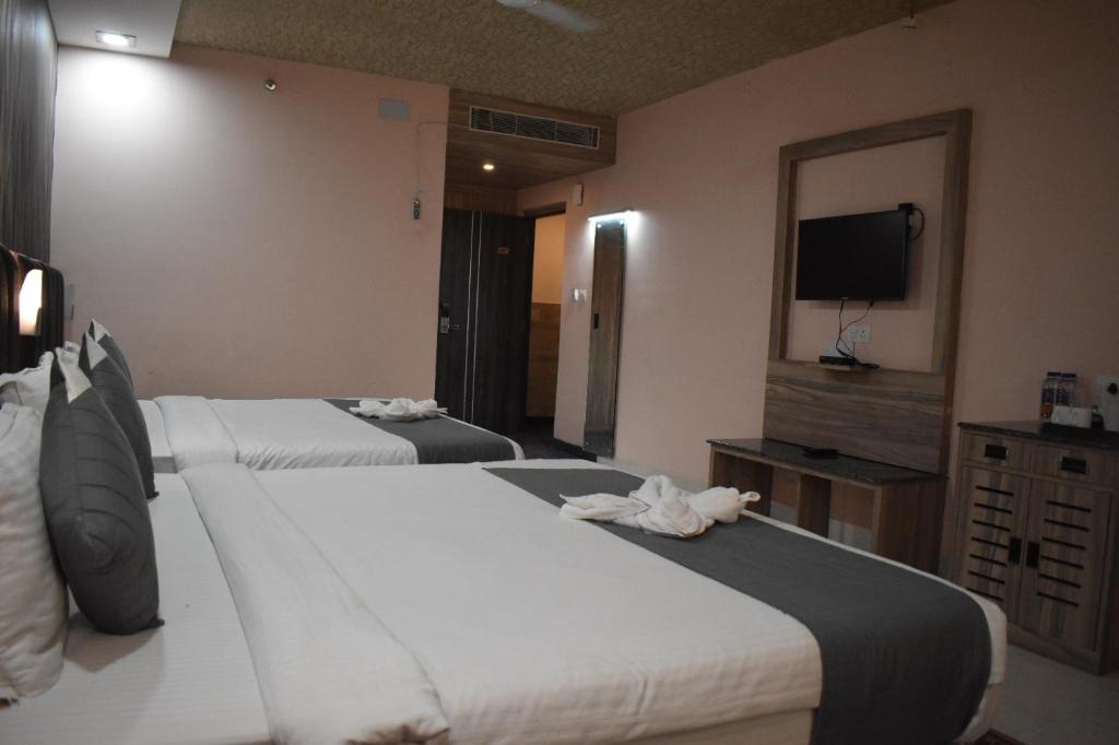 Postel nebo postele na pokoji v ubytování Hotel Vip Square