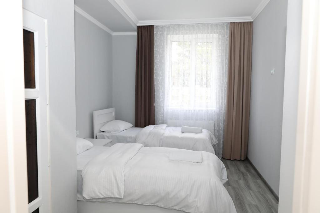 Letto o letti in una camera di VST KHANOYAN'S HOTEL