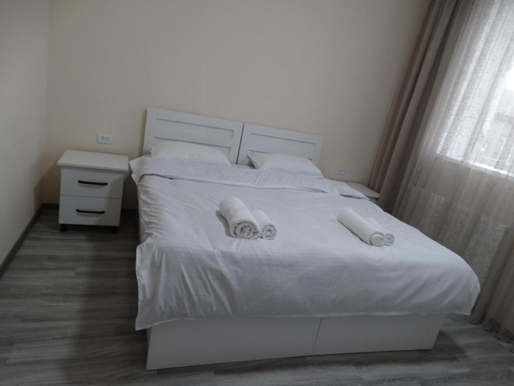 Letto o letti in una camera di VST KHANOYAN'S HOTEL