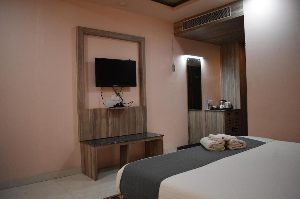 Postel nebo postele na pokoji v ubytování Hotel Vip Square