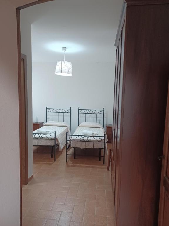 Postel nebo postele na pokoji v ubytování Casa di Adriano