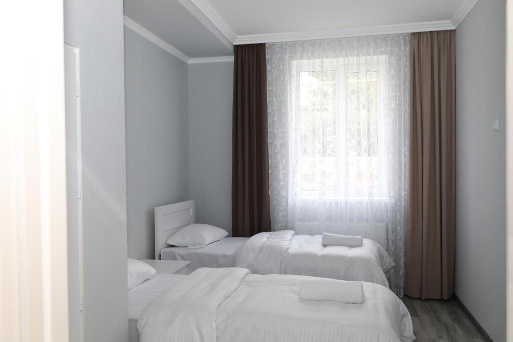 Letto o letti in una camera di VST KHANOYAN'S HOTEL