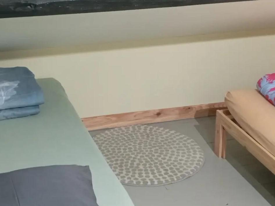 Postel nebo postele na pokoji v ubytování Le Relais De Rochepaule