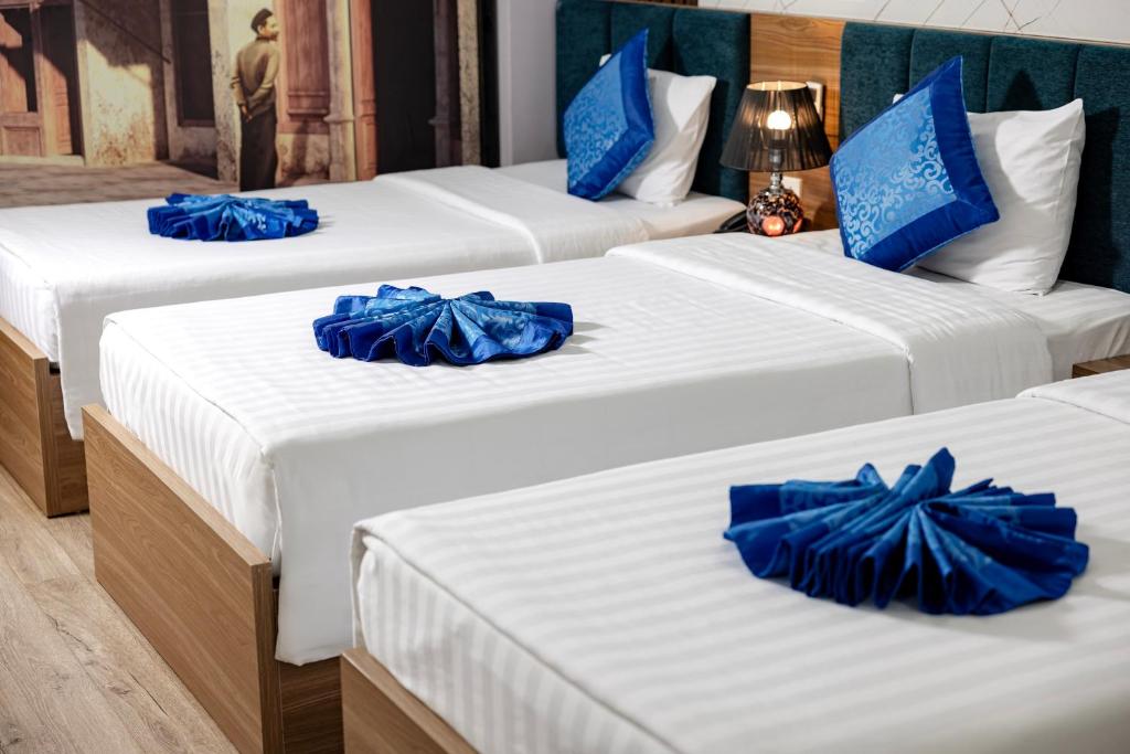 Postel nebo postele na pokoji v ubytování Aquarius Grand Hotel