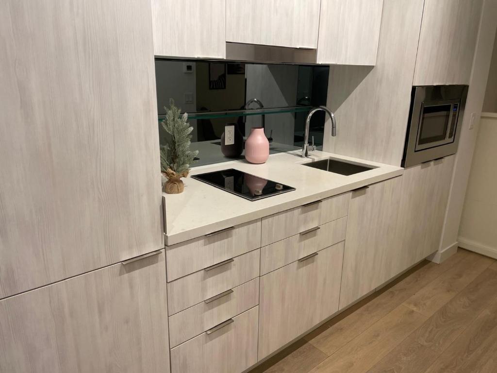 a kitchen with a sink and a counter top at Toronto Premier INN in Toronto