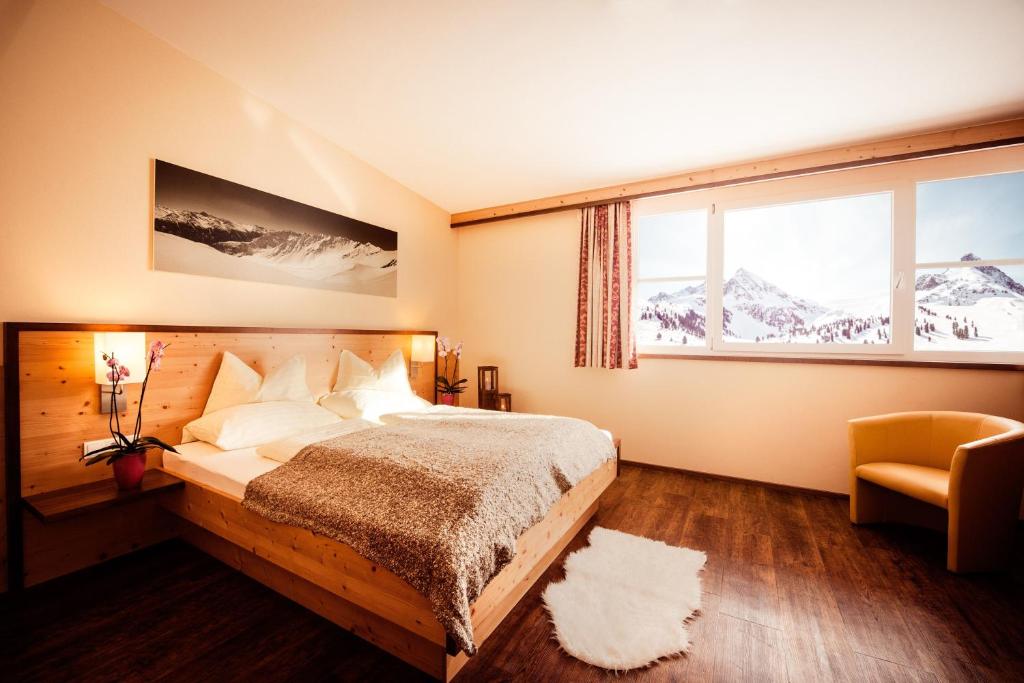 Postel nebo postele na pokoji v ubytování Hotel Alpenrose aktiv & sport