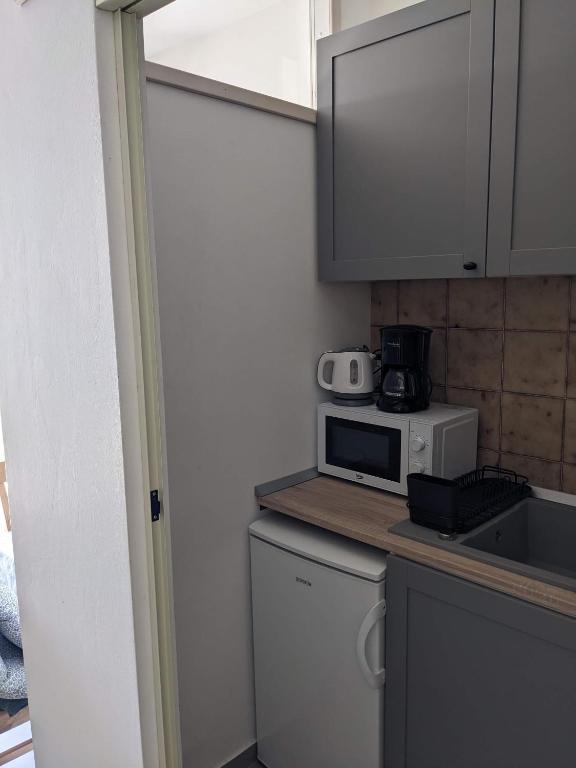 Kuchyň nebo kuchyňský kout v ubytování Appa Apartments
