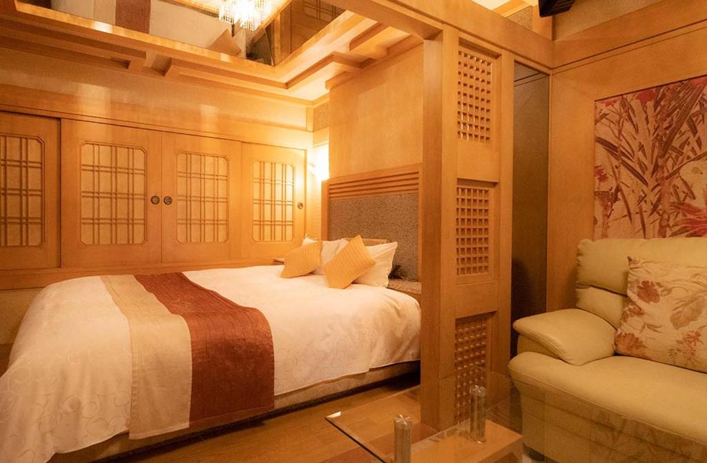 Postel nebo postele na pokoji v ubytování Hotel Dion ホテル ディオン - Adult Only