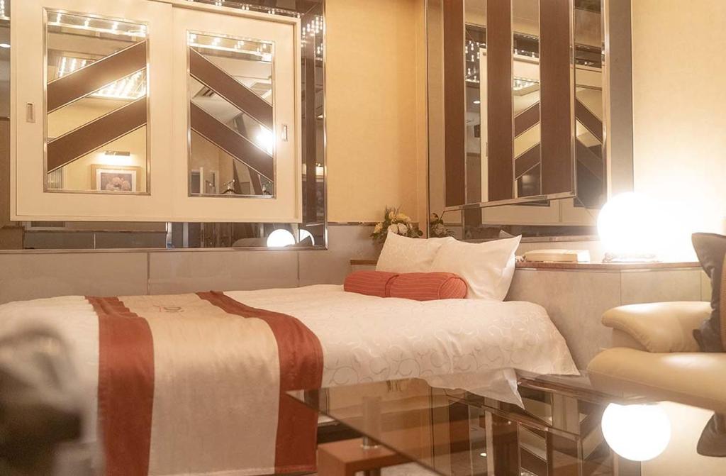 Postel nebo postele na pokoji v ubytování Hotel Dion ホテル ディオン - Adult Only
