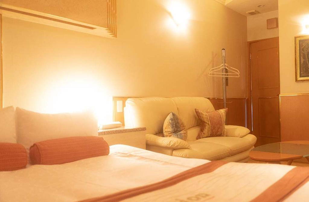 Postel nebo postele na pokoji v ubytování Hotel Dion ホテル ディオン - Adult Only