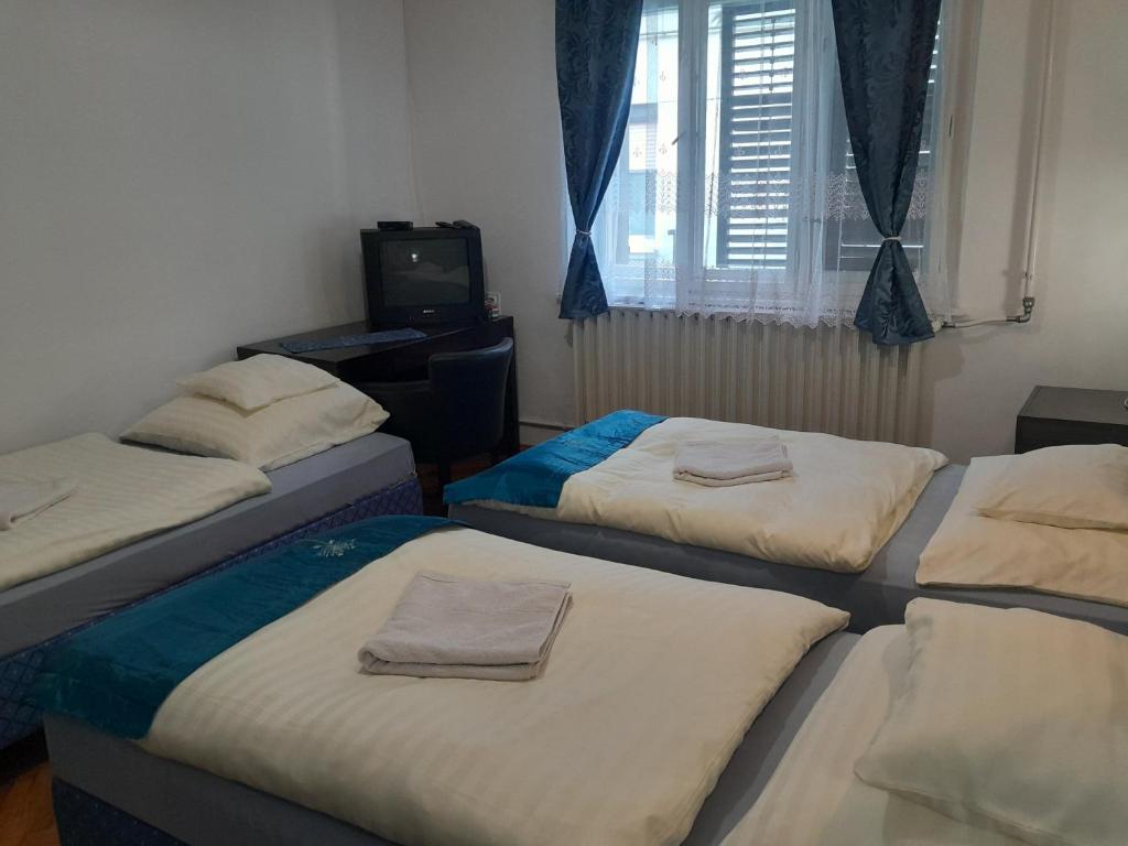 Postel nebo postele na pokoji v ubytování Kék Vándor Vendégház