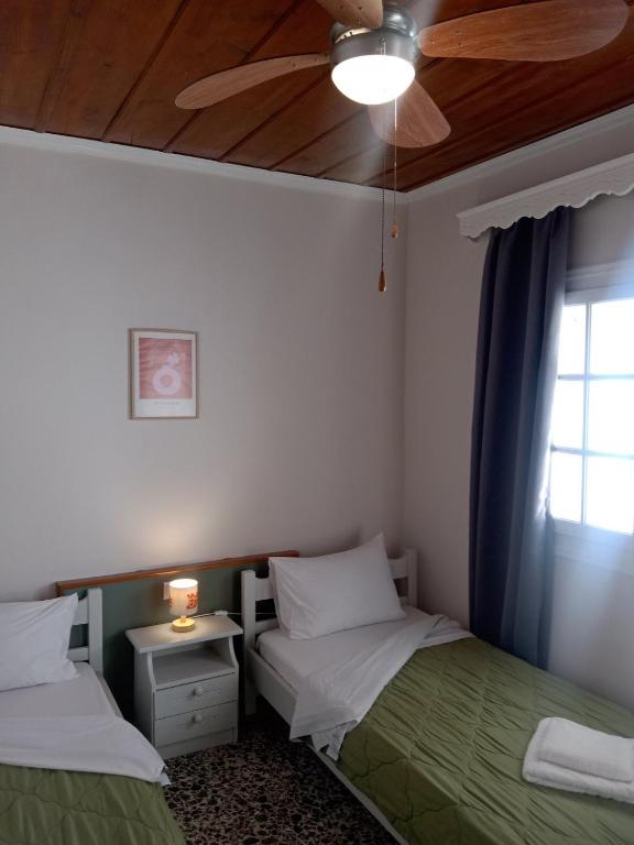 Postel nebo postele na pokoji v ubytování Menegis Apartment