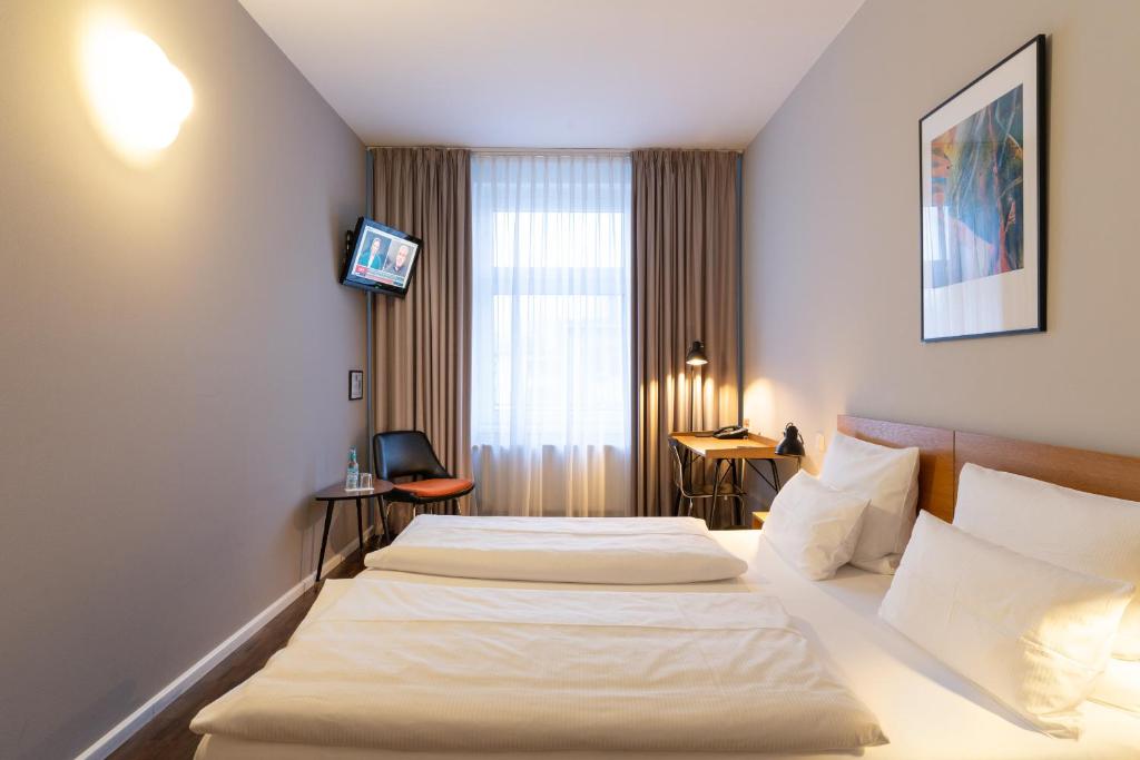 Postel nebo postele na pokoji v ubytování Hotel Johann