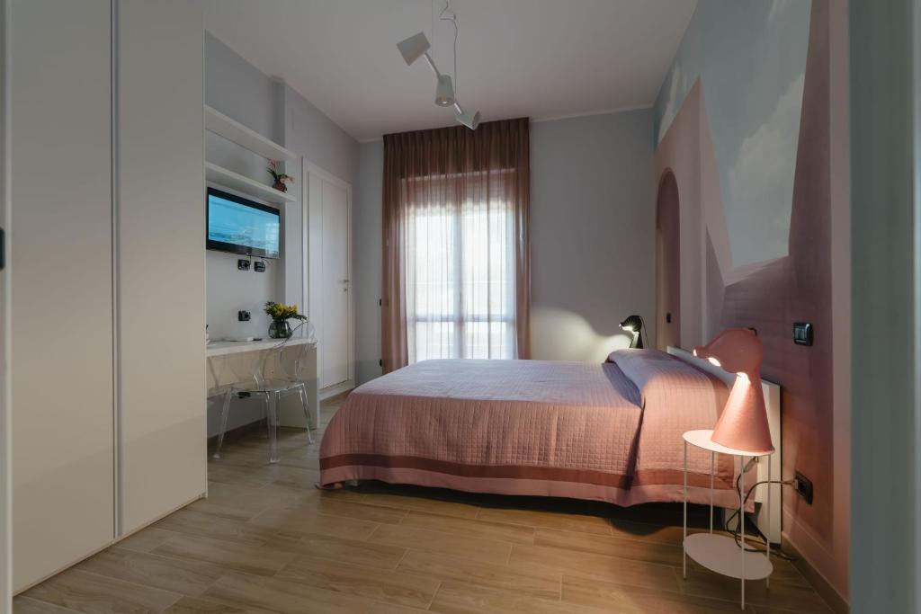 Postel nebo postele na pokoji v ubytování B&B La Perla