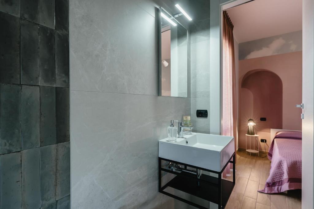 Postel nebo postele na pokoji v ubytování B&B La Perla
