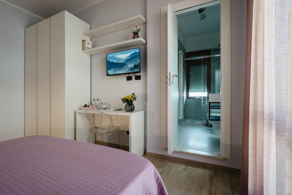 Postel nebo postele na pokoji v ubytování B&B La Perla
