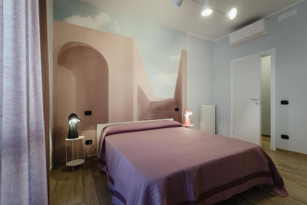 Postel nebo postele na pokoji v ubytování B&B La Perla