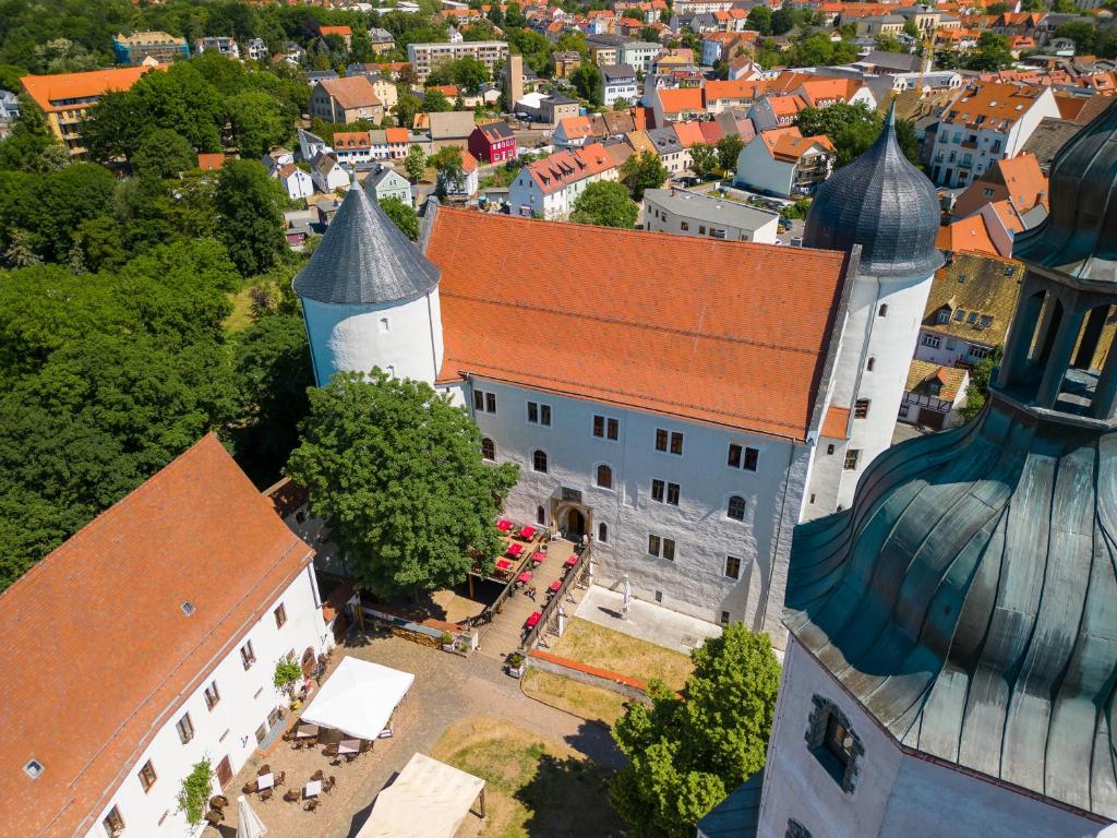 an aerial view of a building and a city at Schloss Hotel Wurzen in Wurzen