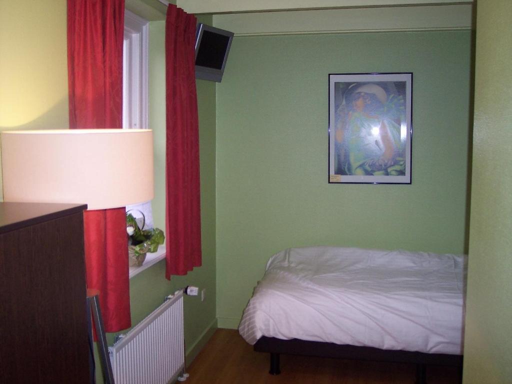 Postel nebo postele na pokoji v ubytování Hotel Bertram