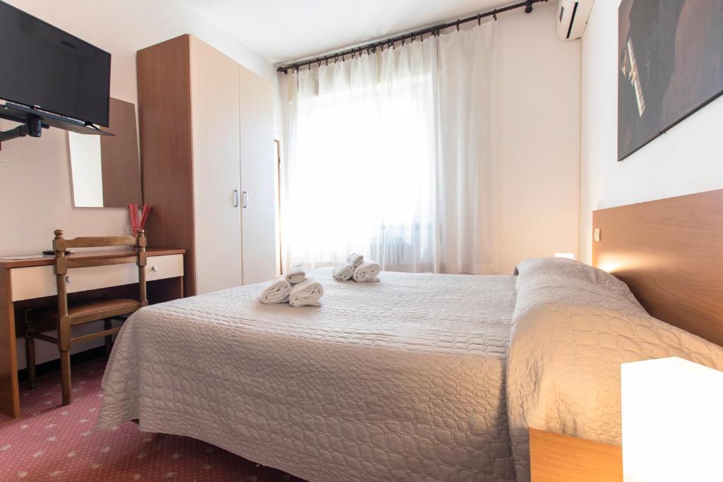 Postel nebo postele na pokoji v ubytování Villa Liberty Versilia