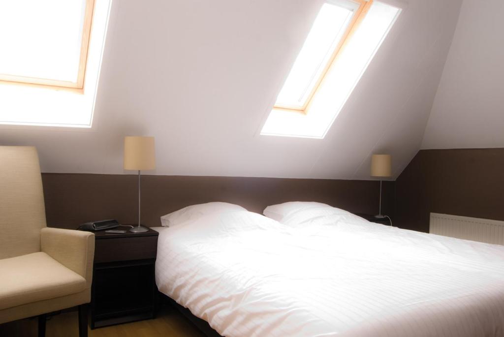 Postel nebo postele na pokoji v ubytování Hotel Bertram