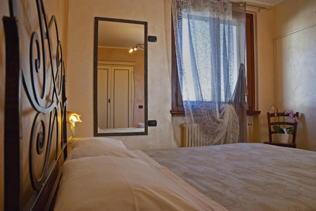 Postel nebo postele na pokoji v ubytování Portola la vecchia dimora