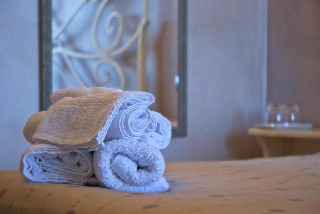 Postel nebo postele na pokoji v ubytování Portola la vecchia dimora