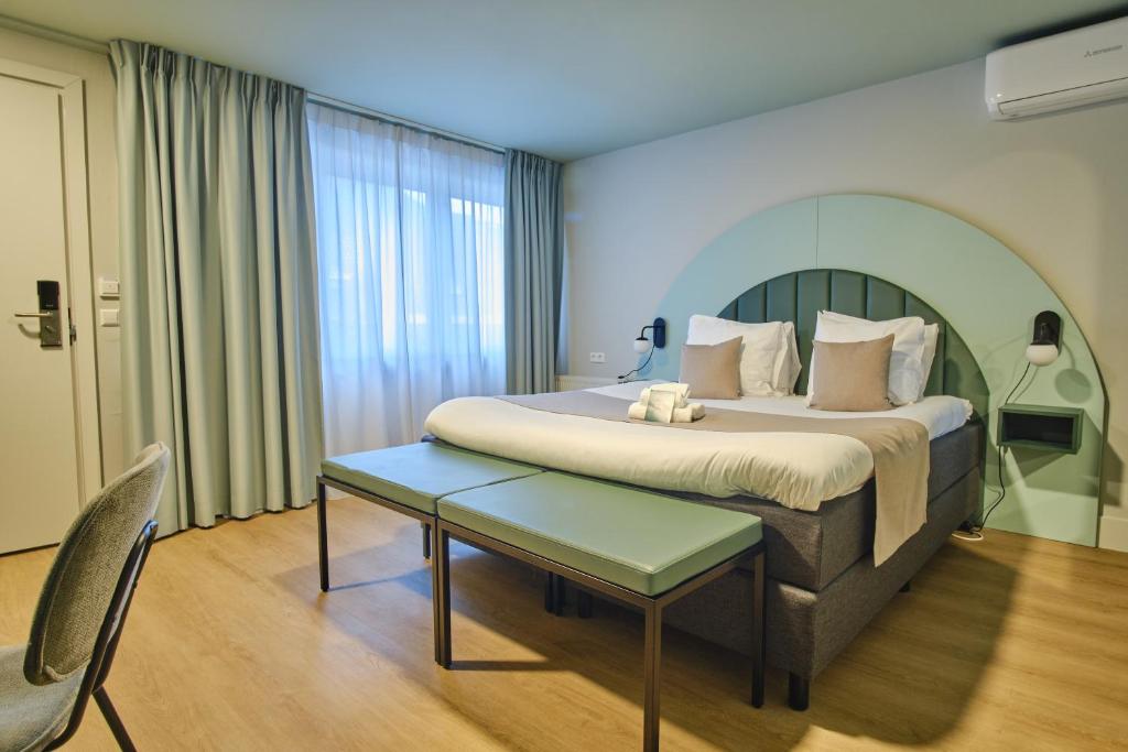 Postel nebo postele na pokoji v ubytování Hotel Halbert