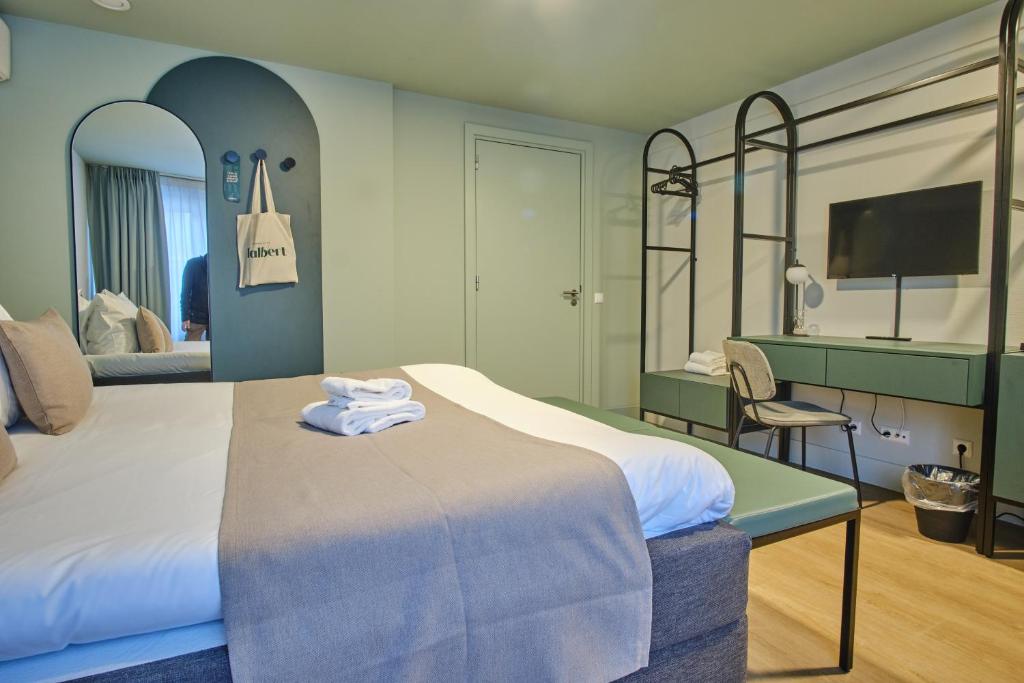 Postel nebo postele na pokoji v ubytování Hotel Halbert