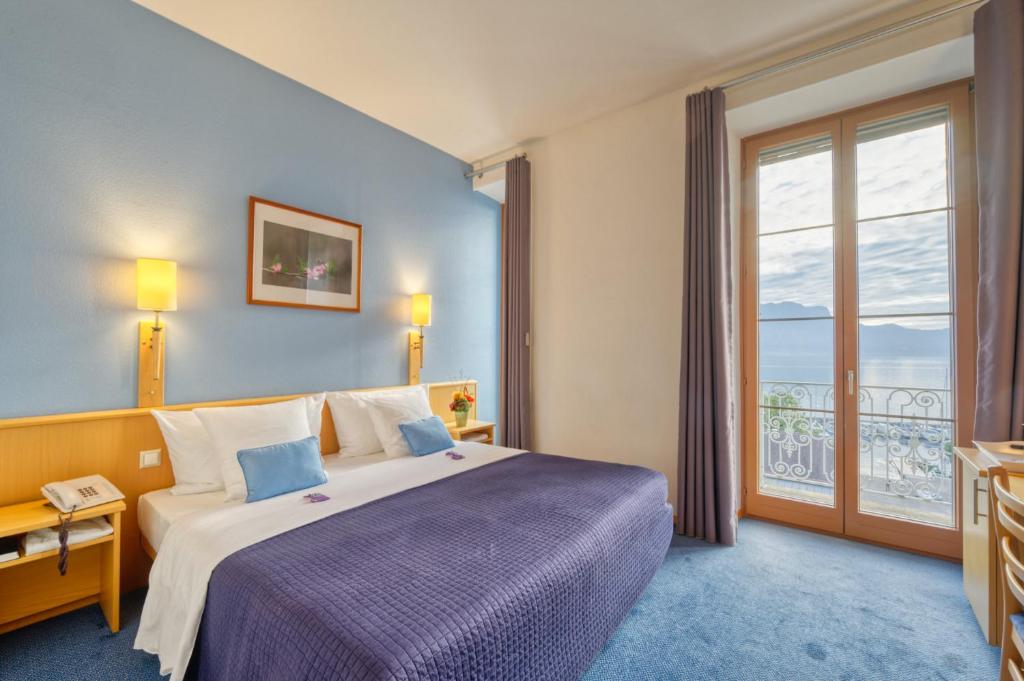 Letto o letti in una camera di Hôtel Bon Rivage