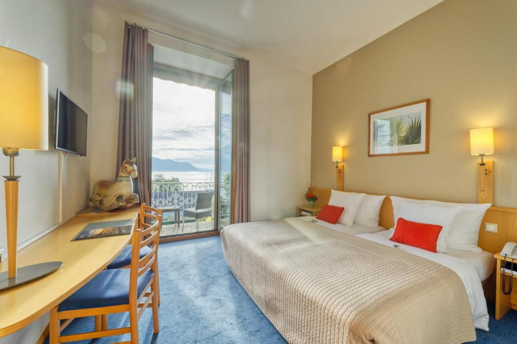 Letto o letti in una camera di Hôtel Bon Rivage